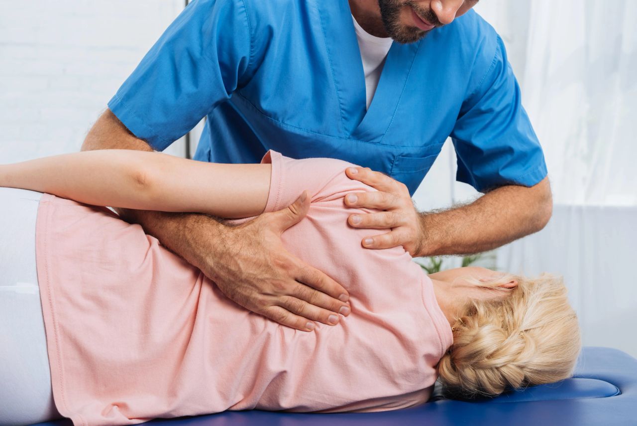woman getting a back adjustment