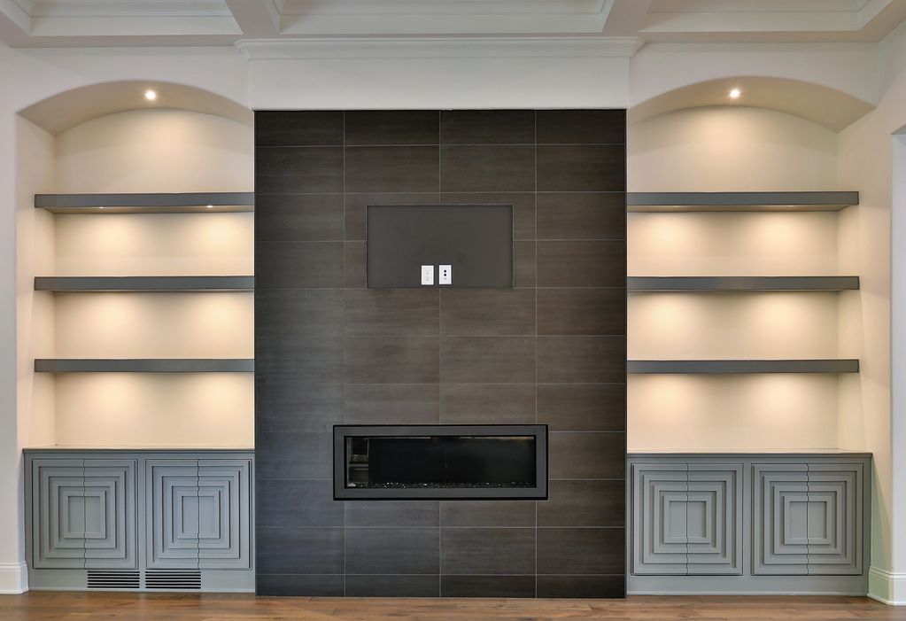 a modern touch of design on this fireplace wall in a custom great room by Pantheon custom homes