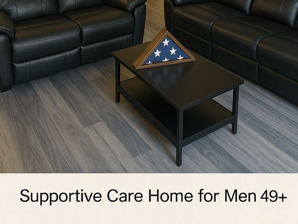 Supportive care home for men 49+ with comfortable seating and flag display.