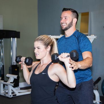 Trainer Nate personal training a client one-on-one at the healthy human in Orlando Florida.