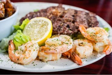 Steak and Sautéed shrimp with roasted potatoes