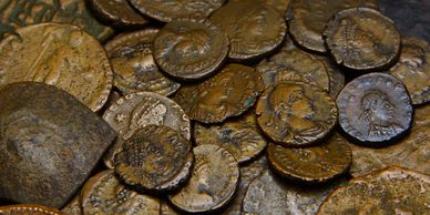closeup shot of pile of old coins 