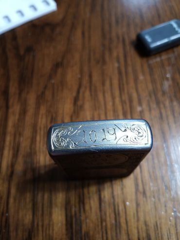 Hand-engraved Zippo with scrollwork and monogram 