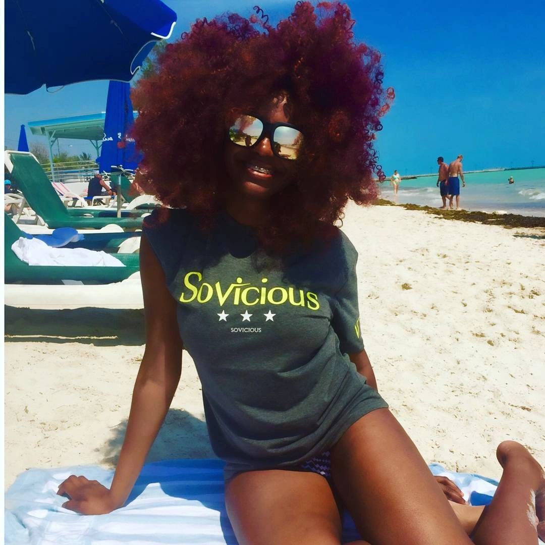 Woman on the beach wearing Sovicious. motivation. fitness lifestyle brand fitness lifestyle clothing