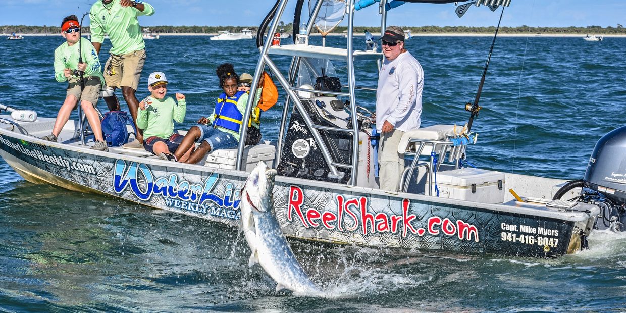 Kids catching fish with charter boat captain Capt Mike Myers, FL.