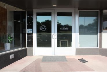 Entrance to a studio space with glass doors.