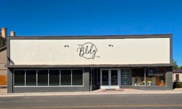 Modern commercial building with "The Bldg Co." sign.