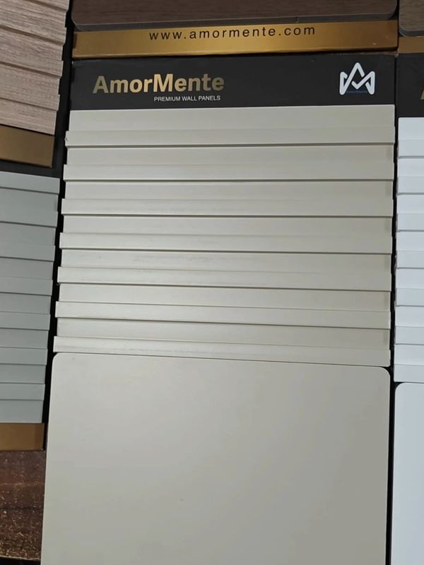 Display of AmorMente premium wall panels in neutral colors.