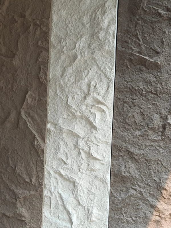 Textured wall panel with varied shades.