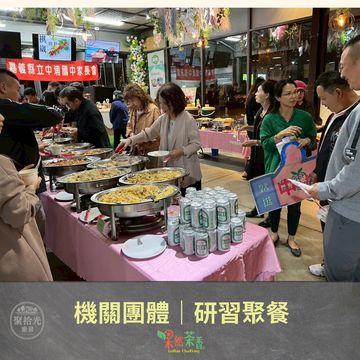 People enjoying a buffet-style meal at a group gathering event.