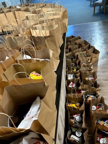 Mission Belly Full volunteers loading meals for donation.