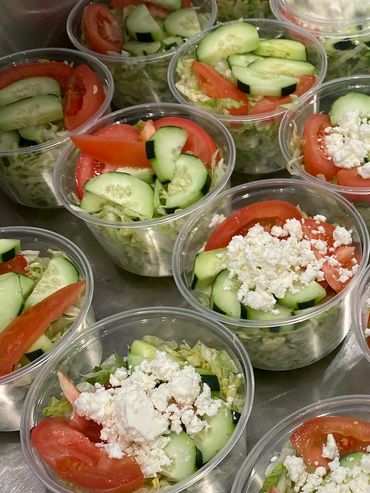 Mission Belly Full meals being prepared for donation.