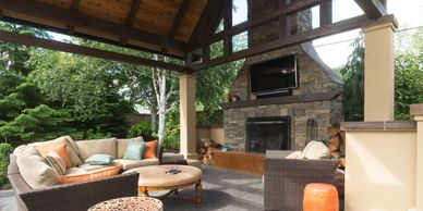 An outdoor living room and fireplace