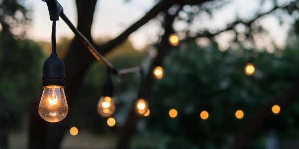 String cafe lights over patio accent lighting
