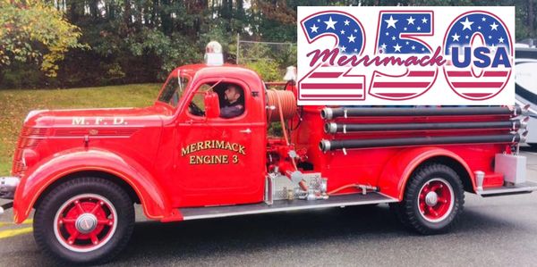 Vintage red Merrimack Engine 3 fire truck on display outdoors.