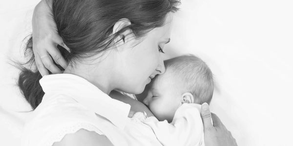 Mom Snuggling sleeping baby 