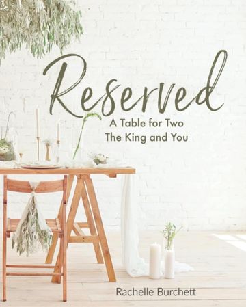 Reserved table setting with wooden chair and candles.