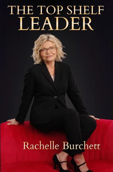 Woman in black suit on red couch, book cover.