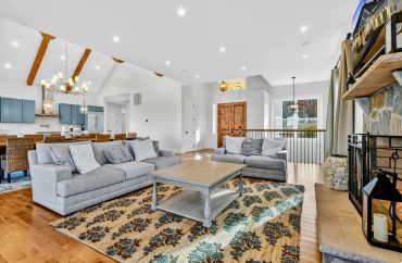  Architectural open floor plan connecting the sunroom to the main living area.