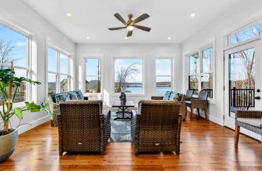  Lake Anna custom home sunroom with extensive exterior window schedule and direct lake views.