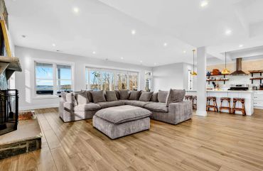 ustom finished walk-out basement with secondary stone fireplace and kitchenette