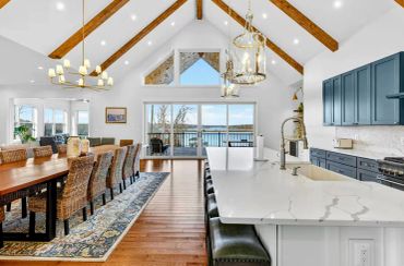 Lake Anna custom kitchen with cathedral ceiling and expansive lakefront sliding glass doors.