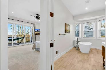 lake Anna custom home primary suite connecting the en-suite bathroom to the bedroom.