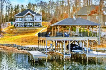  Lake Anna waterfront new construction home featuring custom boat dock and A-frame architecture.