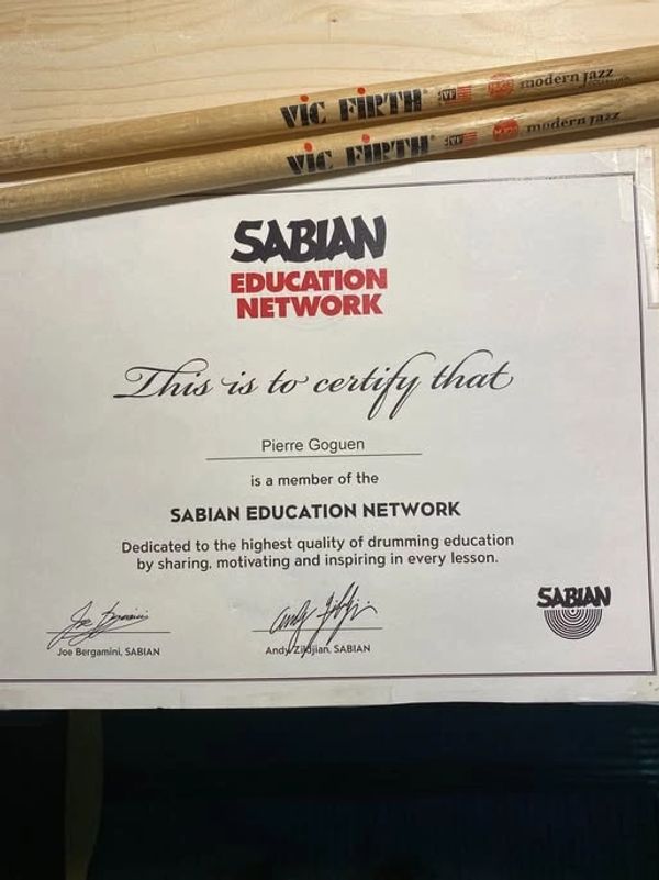 Certificate for Pierre Goguen from Sabian Education Network with Vic Firth drumsticks.