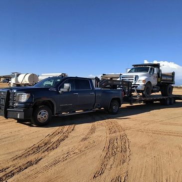 Hauling a 5 Yard Dump Truck 