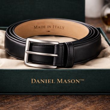 Black leather belt in a Daniel Mason box labeled Made in Italy.