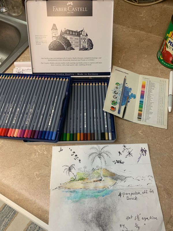 Faber-Castell colored pencils and a beach sketch.