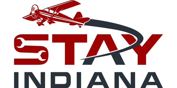 Logo with a red airplane and 'Stay Indiana' text.