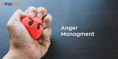 Hand squeezing an angry face stress ball.