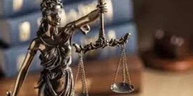 Statue of Lady Justice holding scales.
