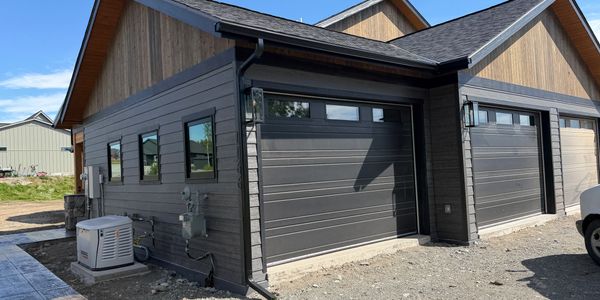 Black seamless aluminum gutter installation on Wasilla Alaska home