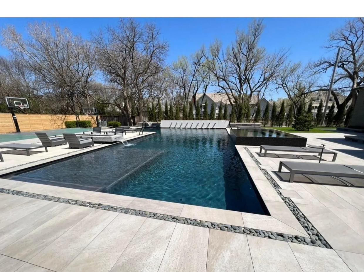 Family enjoying custom pool in a landscaped Derby, KS, backyard