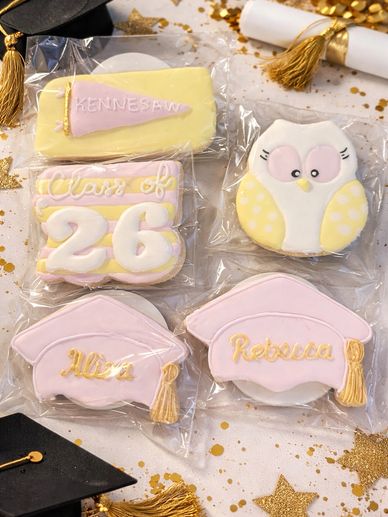 Decorative graduation-themed cookies with names and class year.