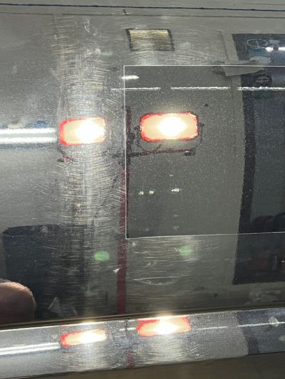 In process paint correction with a square section showing the corrected paint.