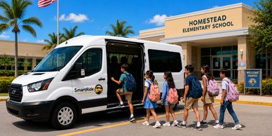 Children boarding a SmartRide van at Homestead Elementary School.