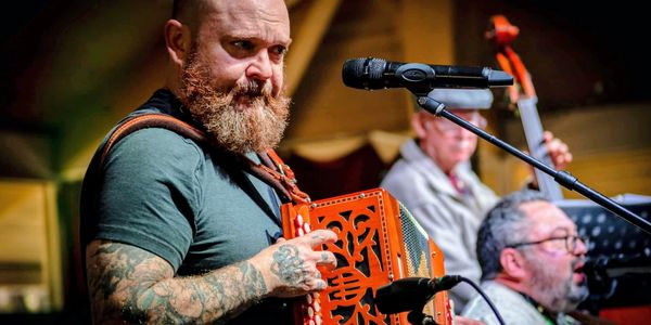 Dan playing accordion at the 2026 Savannah Irish Festival
