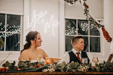 Couple sharing a tender moment at their wedding reception.