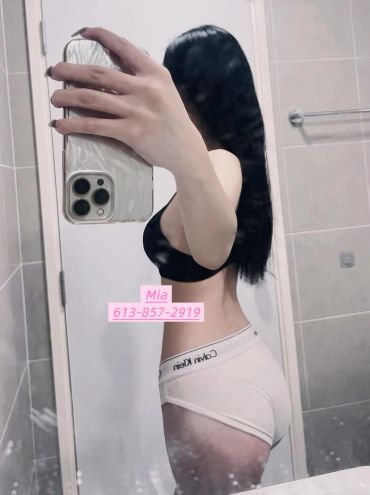 Mirror selfie of a woman in underwear.