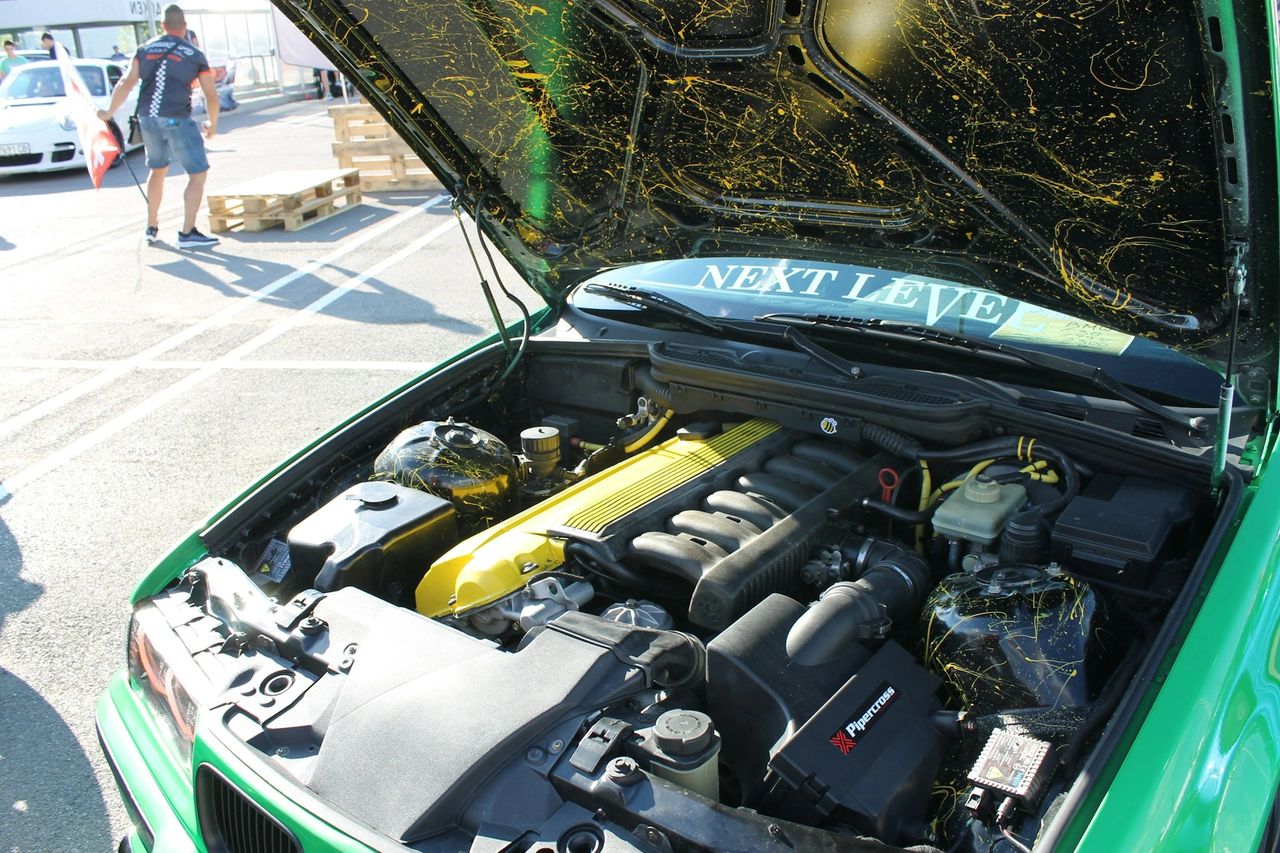 An open hood of a car