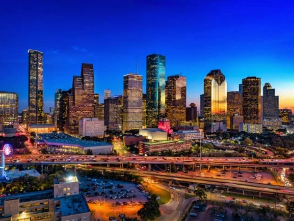Houston skyline lit up during the night.