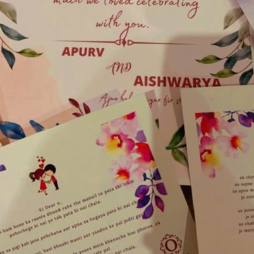 Wedding invitation cards with floral designs for Apurv and Aishwarya.
