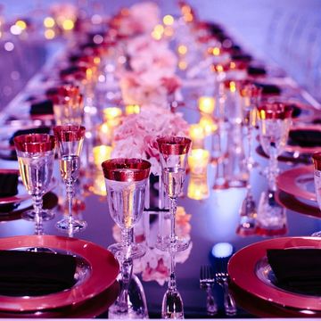 Elegant table setting with rose gold accents and soft lighting.