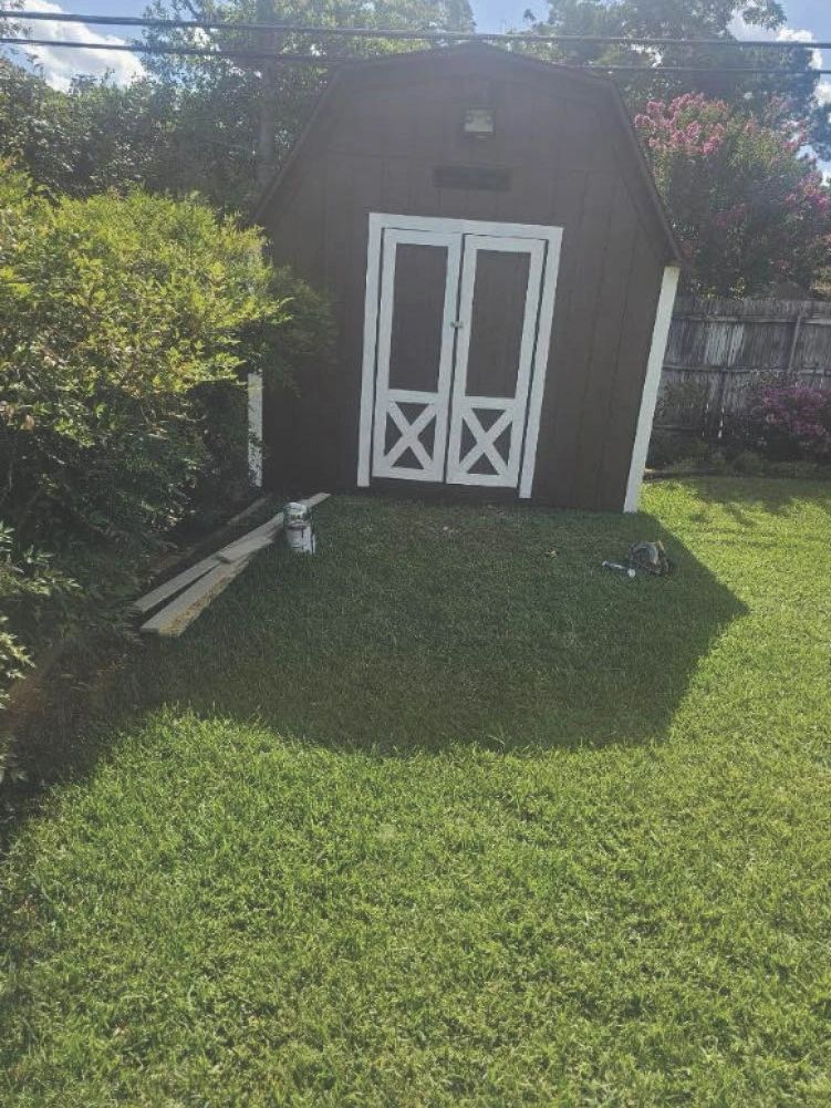 Custom outdoor storage shed painted in brown located in arlington Tx front view