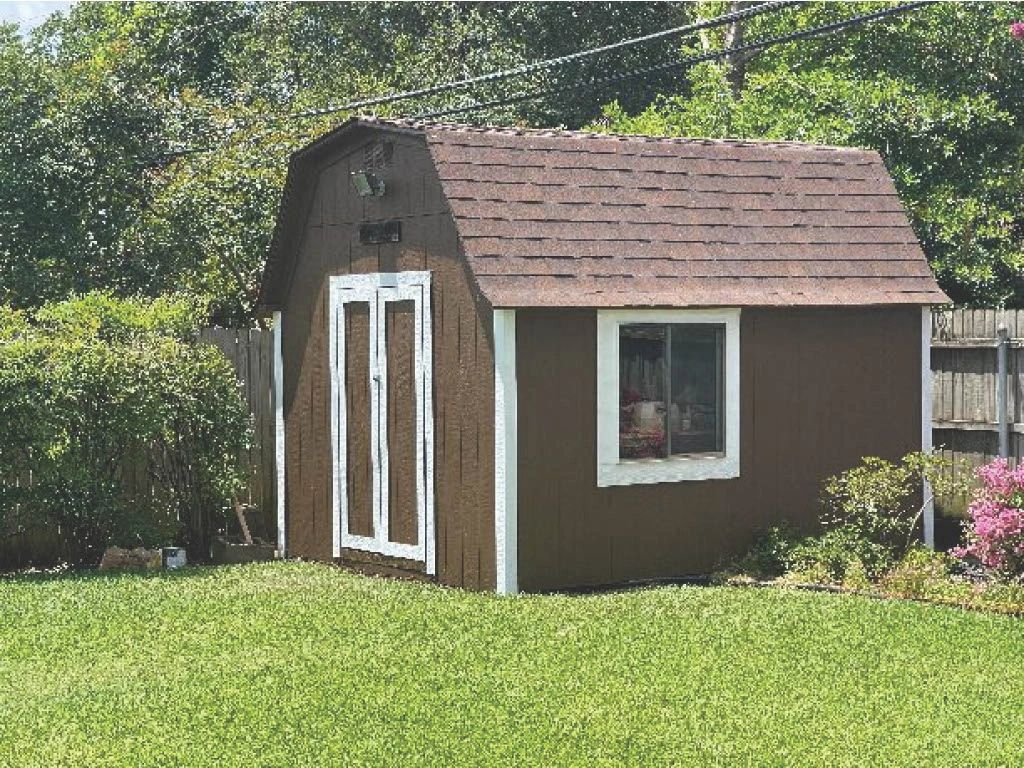Custom outdoor storage shed painted in brown located in arlington Tx side view