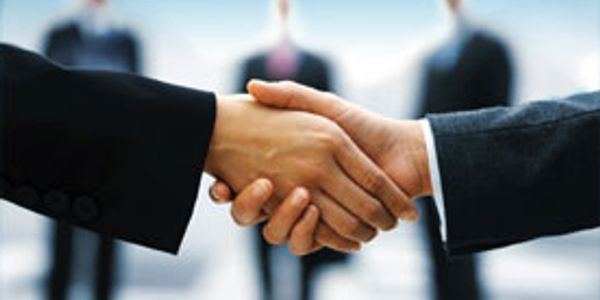 Two businesspeople shaking hands.